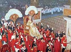 Pope Pius XII, wearing the traditional 1877 Papal tiara, is carried through St. Peter's Basilica on a sedia gestatoria; c. 1955.