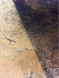 Satellite image of the border between Israel and Egypt. The Egyptian side, to the left, is overgrazed.