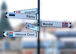 Fingerposts in Oskarshamn, Sweden, showing the direction from the post to each of the city's twin towns