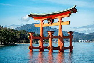 The torii gateway to the Itsukushima Shrine in Hiroshima Prefecture, Japan, one of the most famous examples in the country.[1] Torii mark the entrance to Shinto shrines and are recognizable symbols of the religion.