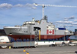 Construction of a Harry DeWolf-class offshore patrol vessel at Halifax Shipyard in 2018. The ship emerged from the Arctic Patrol Ship project.