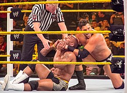 Curtis wrestling Percy Watson at a NXT event in 2012.