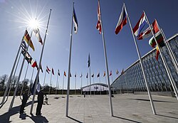 Flags of NATO member countries outside the NATO headquarters in Brussels.