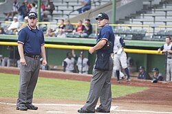 Ryan Blakney (left) and Ben May umpiring in the Midwest League in 2008