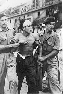 Haifa July 1947. British soldiers remove injured passenger from SS Exodus