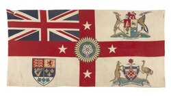A British Empire flag combining the arms of the dominions to represent their growing significance