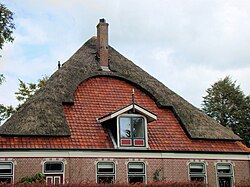 Farm-house in the Netherlands near Alkmaar. The combination of thatch and roof tiles is quite common in that area.
