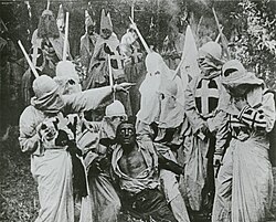 A scene from the 1915 movie, The Birth of a Nation, showing an African-American character, Gus (played by white actor Walter Long, in blackface), about to be killed by the Ku Klux Klan