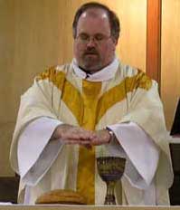 A Methodist minister consecrating the Eucharist elements during the Service of the Word and Table