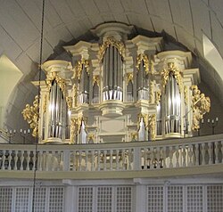 Color image of ornate organ in Germany associated with Bach