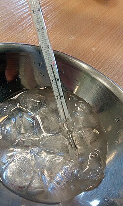 Measurement of an ice-water mixture in equilibrium at 370 m above sea level. Thermometer shows 0.05 °C. The slight deviation from 0 °C is due to instrument uncertainty and trace water impurities.