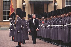 President Bill Clinton reviews honor guards at Buckingham Palace during a 1995 state visit to the UK.