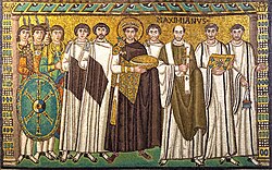 A mosaic showing Justinian with the bishop of Ravenna (Italy), bodyguards, and courtiers.[59]