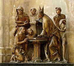 Baptism of Augustine of Hippo as represented in a sculptural group in Troyes Cathedral (1549), France