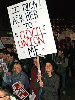 Many advocates, such as this November 2008 protester at a demonstration in New York City against California Proposition 8, reject the notion of civil unions, describing them as inferior to the legal recognition of same-sex marriage.[79]