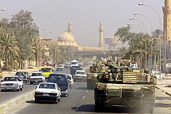 A Marine Corps M1 Abrams tank patrols Baghdad after its fall in 2003
