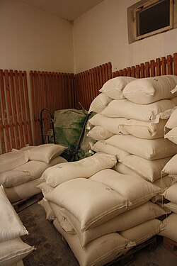 Flour being stored in large cloth sacks