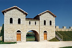 A 1990 replica of the Porta decumana of the Biriciana. View over the camp ring road