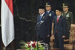 Yudhoyono standing next to his successor, Joko Widodo, during the latter's inauguration, October 2014