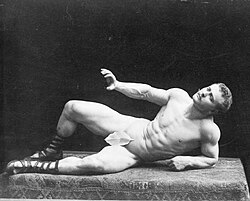 Bodybuilding pioneer Eugen Sandow portraying The Dying Gaul, a pose taken from an ancient Roman sculpture.