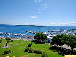 Mackinac Island, an island and resort area at the eastern end of the Straits of Mackinac. More than 80% of the island is preserved as Mackinac Island State Park.