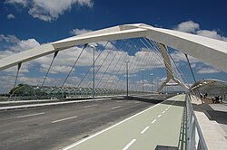 Zaragoza's Third Millennium Bridge spans the Ebro and is the world's largest concrete tied-arch bridge, with six traffic lanes, two bike lanes, and two glass-enclosed walkways for pedestrians.[73]