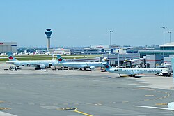 Airport apron of Pearson Airport, Canada's busiest airport. Control tower visible in background.