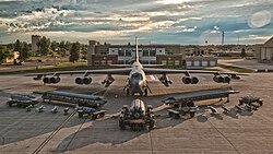 A B-52H Stratofortress and munitions are displayed in front of the Base Operations building at Minot Air Force Base