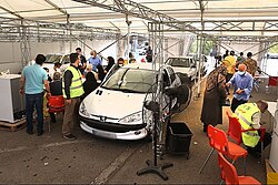 A drive-through COVID‑19 vaccination center in Iran, August 2021