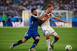 Lavezzi challenging Germany's Benedikt Höwedes in the 2014 FIFA World Cup Final