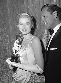 Kelly with William Holden at the 27th Academy Awards in 1955