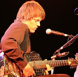 An eight-string baritone tricone resonator guitar