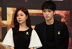 Kim Jae-joong (right) with co-star Baek Jin-hee for the premiere of Triangle