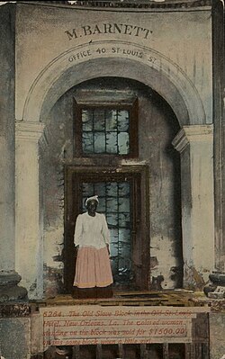 Divided-back era postcard: "The Old Slave Block in the Old St. Louis Hotel, New Orleans, La. The colored woman standing on the block was sold for $1500.00 on this same block when a little girl."