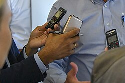 Many members of the media use recorders to capture remarks.