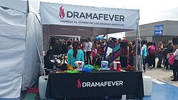 A booth of American video streaming website DramaFever at a Korean fan convention in Mexico. The website offered on-demand streaming video of K-dramas, among others, from 2009 to 2018.