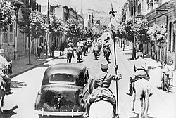 Allied forces escorted by Circassian cavalry of the Troupes spéciales (1941).