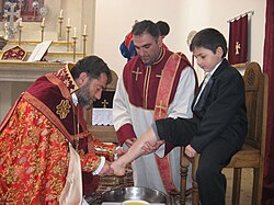Bishop Sebouh Chouldjian of the Armenian Apostolic Church washing the feet of children