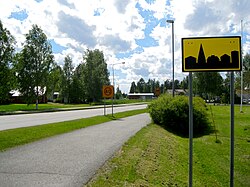 A street sign in Vimpeli indicating the beginning of an urban area in Finland
