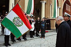 The then-president of Italy Carlo Azeglio Ciampi honors the flag of Cispadane Republic, the first Italian flag, during the Tricolour Day on 7 January 2004 in Reggio Emilia.