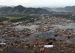 A village near the coast of Sumatra lies in ruin on 2 January 2005 after the devastating tsunami that struck on Boxing Day 2004