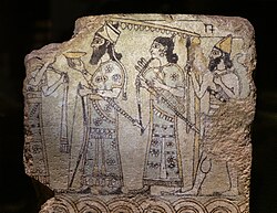 Glazed tile from Nimrud depicting a Neo-Assyrian king, accompanied by attendants