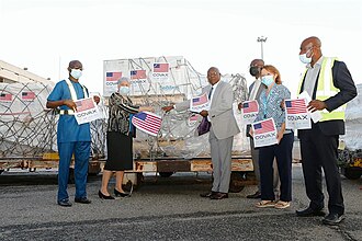 US Officials deliver COVID-19 vaccines to Ghana as part of the COVAX program in 2021. Ghana was the first recipient of vaccines through COVAX.