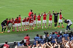 Giroud (number 12, both hands raised) celebrating the 2014 FA Community Shield with Arsenal