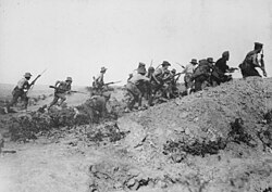Australian troops charging near a Turkish trench during the Gallipoli campaign