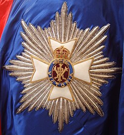 A detailed view of a stumpwork and goldwork embroidered star of a Knight or Dame Grand Cross of the Royal Victorian Order
