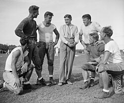 Marshall talking with Washington Redskins players, 1937