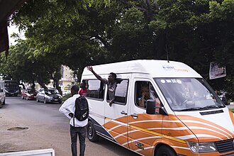 A Mercedes-Benz Sprinter bus with a mate