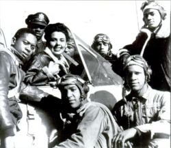 Lena Horne posing with the Tuskegee Airmen in Tuskegee, Alabama, during World War II[N 1]