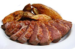 Duck can have a red appearance. However, studies on the health effects of red meat do not consider duck or any type of poultry to be red meat.